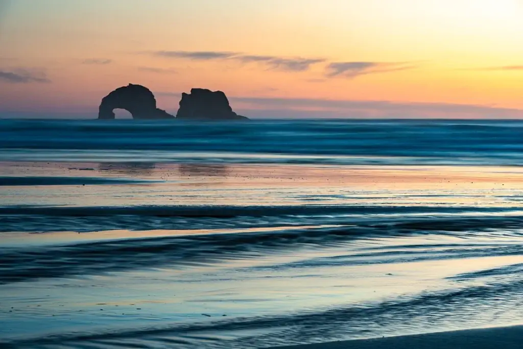 Sunset over Twin Rocks at Rockaway Beach