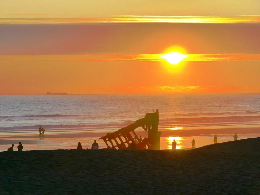 Sunset over the Peter Iredale shipwreck at Fort Stevens State Park in Warrenton, Oregon